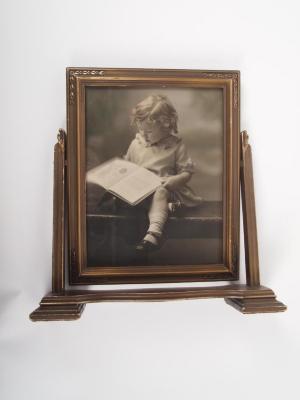 Photograph, Of a Seated Child Reading a Book