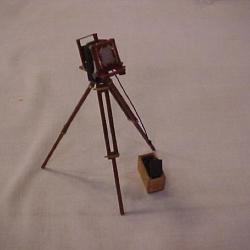 Model Camera On Tripod And Small Box With Slides For Furniture Factory Model