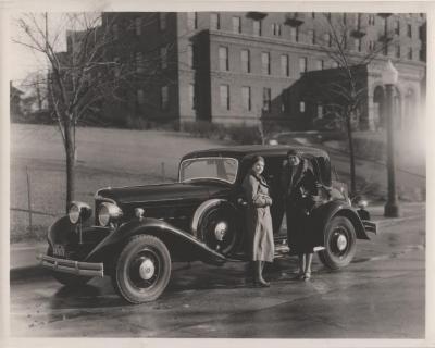 Photograph, Car and Two Ladies in front of Butterworth Hospital