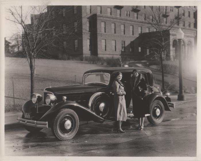 Photograph, Car and Two Ladies in front of Butterworth Hospital