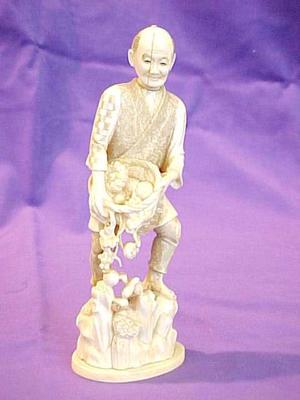 Carved Ivory Figure, 'the Gardener'