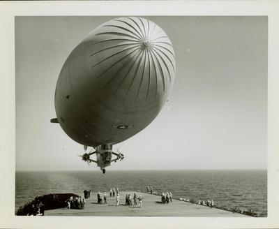 Photograph, Landing of a U.S. Navy Blimp on Flight Deck of U.S. S. Rudyerd Bay