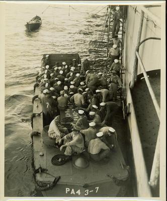 Photograph, Sailors boarding a landing craft(PA4 3-7) in the Pacific