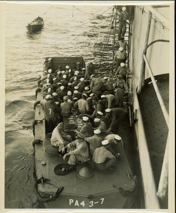Photograph, Sailors boarding a landing craft(PA4 3-7) in the Pacific