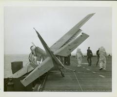 Photograph, Salvaging an FM2 aircraft aboard the U.S.S. Rudyerd Bay
