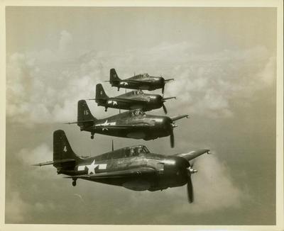 Photograph, Four FM-1 (F4F-4) Wildcats flying in formation, Pacific Theater