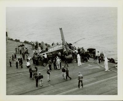 Photograph, Salvaging an FM2 aircraft aboard the U.S.S. Rudyerd Bay