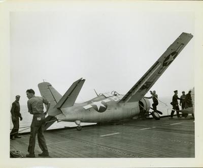 Photograph, Crashed FM2 #16586 aboard the U.S.S. Rudyerd Bay