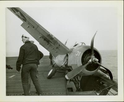 Photograph,  Crashed FM2 #16586 aboard the U.S.S. Rudyerd Bay