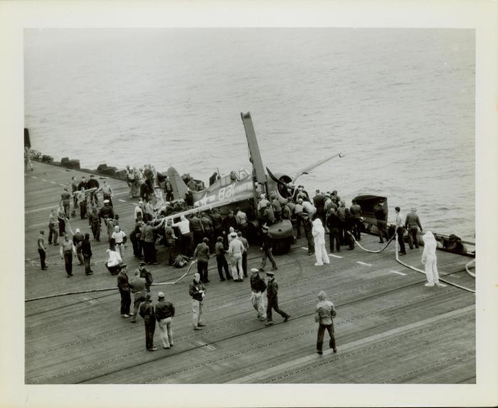 Photograph, Salvaging an FM2 aircraft aboard the U.S.S. Rudyerd Bay