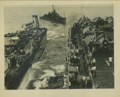 Photograph, A surviving sailor from the U.S.S. Houston being highlined from ship to ship