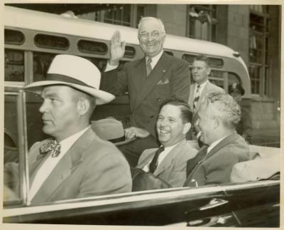 Photograph, President Harry S. Truman riding in an automobile while in Grand Rapids, Michigan for a campaign speech