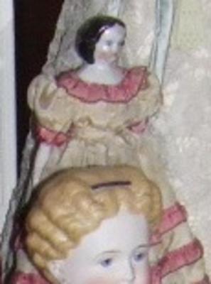 Glazed China Head Doll With Yellow Dress